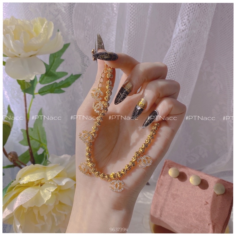 Lắc tay bi xi 2 màu trắng, vàng charm logo X, lắc bi charm thương hiệu sang trọng .PTNACC.