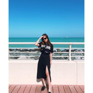 Chân váy xẻ tà midi