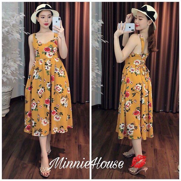 đầm vàng thắt nơ lưng.