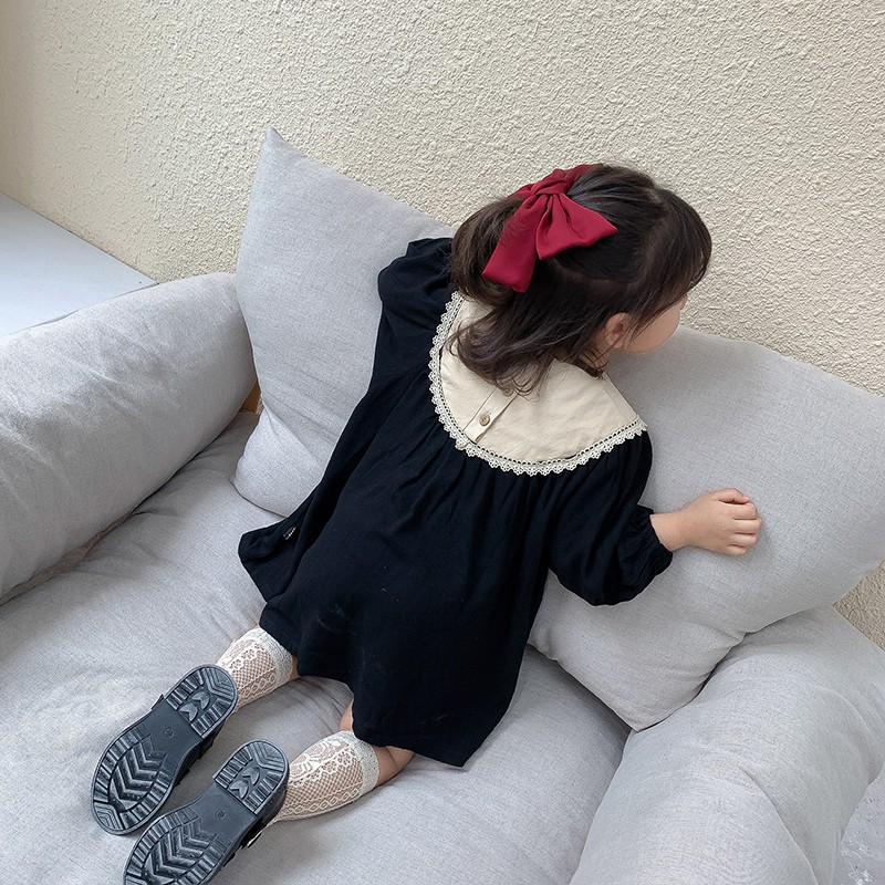 Váy baby doll thô đũi tằm đen thêu hoa cho bé