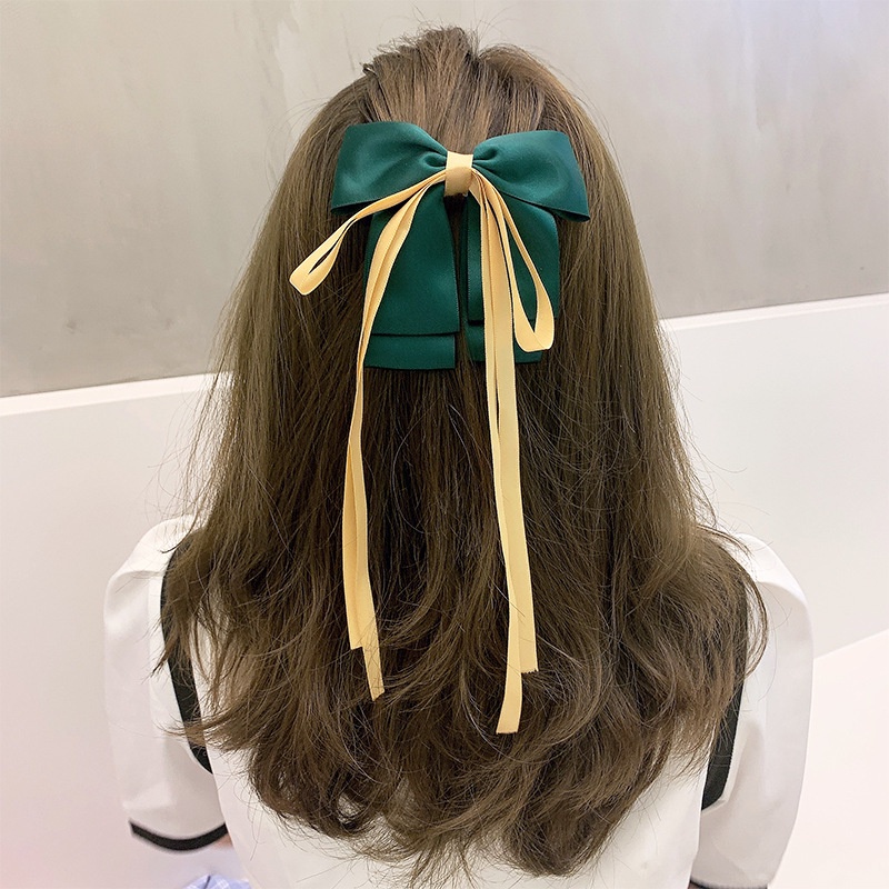 Kẹp tóc nơ nữ tính đơn giản và dễ thương