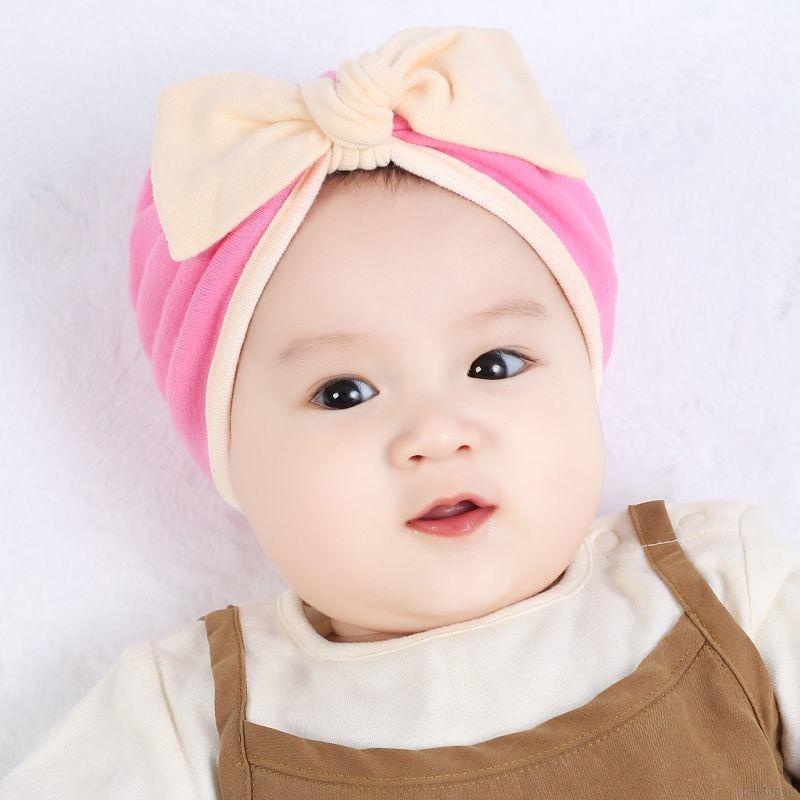 Mũ trùm đầu beanie đính nơ màu trơn đáng yêu dành cho trẻ em