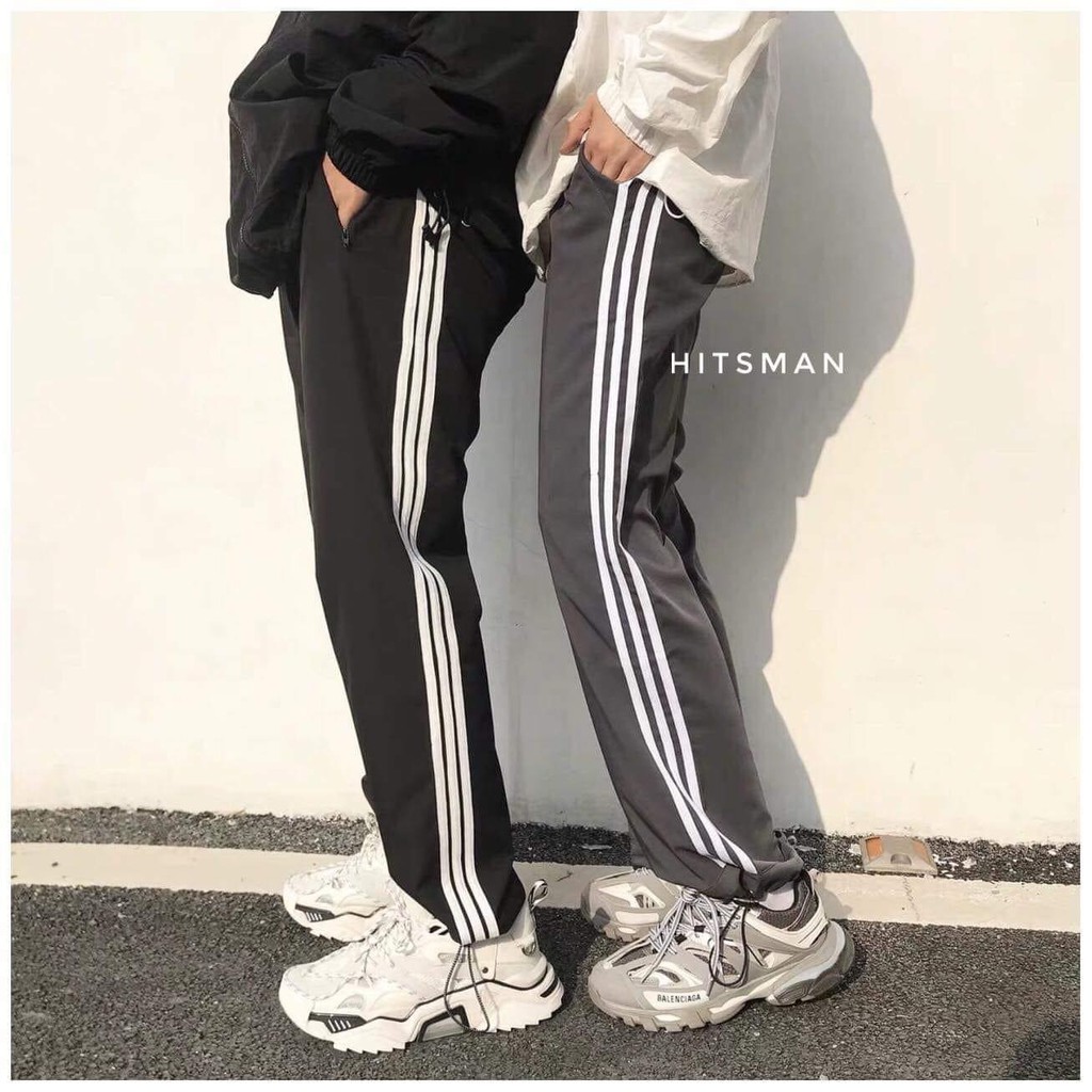 Quần 3 sọc Unisex dáng baggy rộng kèm dây rút dưới chân