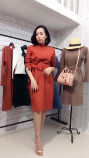 Váy len nơ QC màu cam đất.