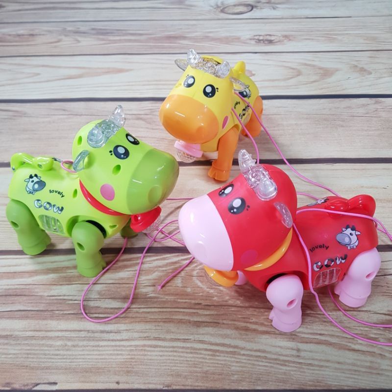 Đồ chơi bò chạy pin có nhac và đèn phát sáng