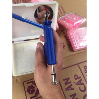 máy bấm lỗ tai