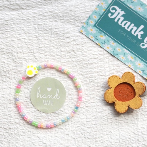 Vòng tay hạt cườm màu pastel charm bàn chân pet đáng yêu