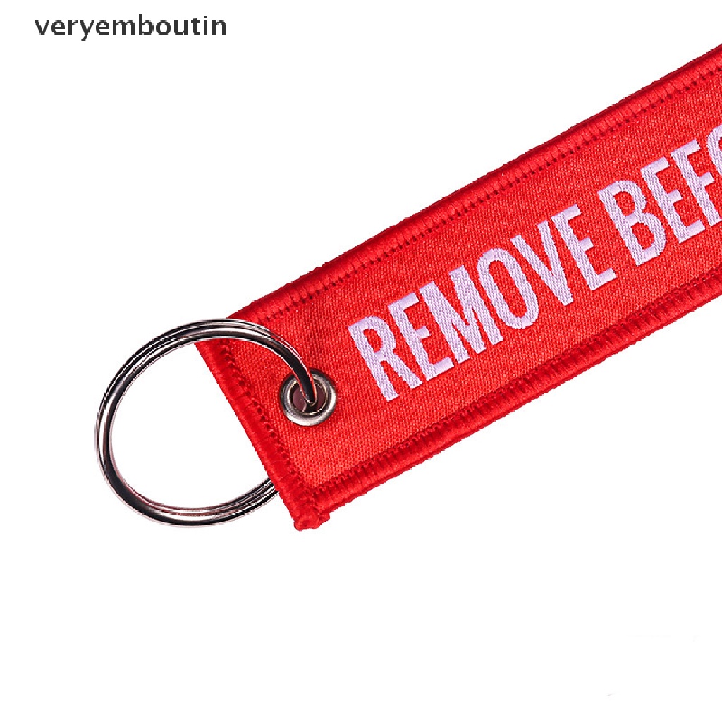Móc khóa vải polyester thêu họa tiết chữ Remove Before Flight cỡ 13*3CM
