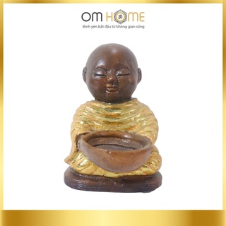 Tượng chú tiểu ôm bát nến om home