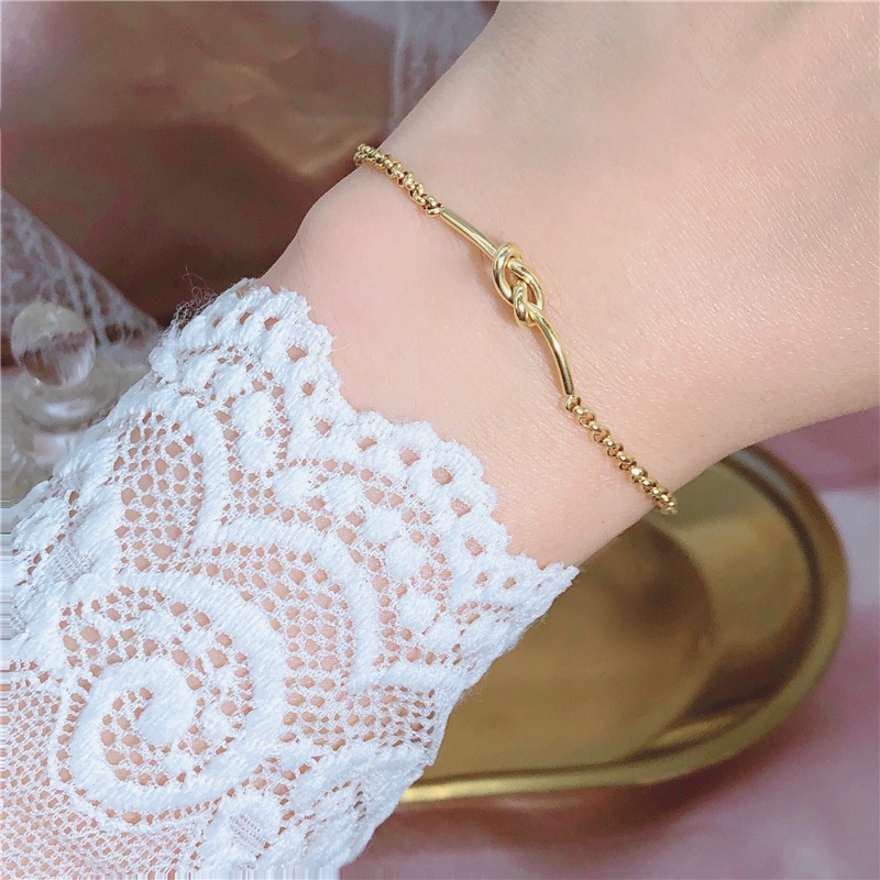 Vòng đeo tay thép titan mạ vàng 18k thắt nút thời trang dành cho nữ