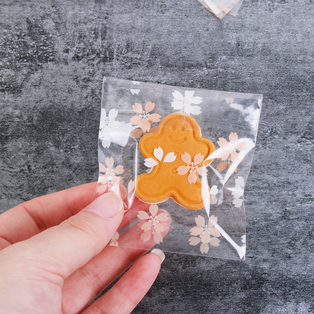 Set 100 túi nhựa dán đựng kẹo in hoa xinh xắn