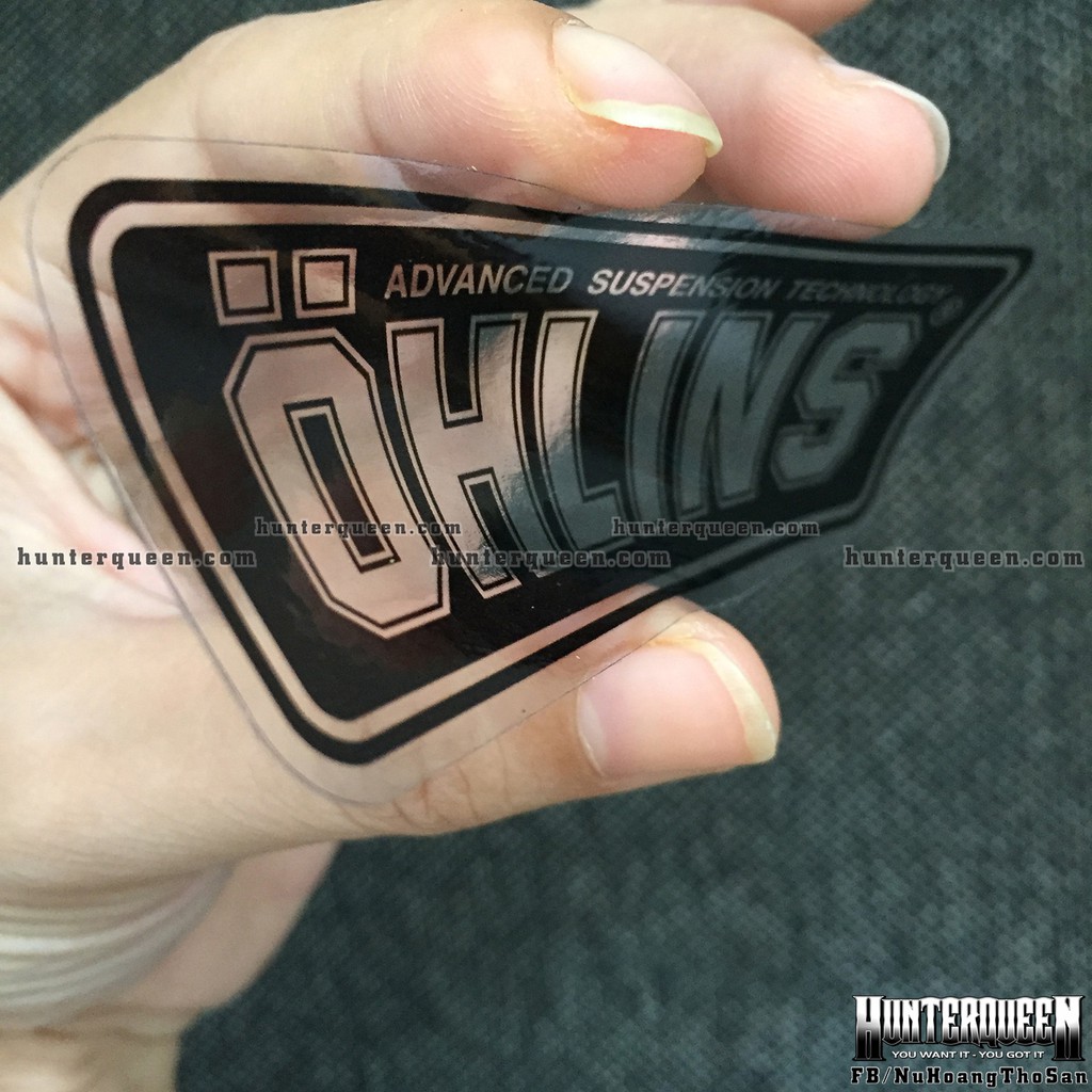 Logo. Oh-Lins[9x3.7cm] trong suốt. Nền đen, chữ xuyên thấu. Hình dán decal siêu dính, chống nước, tem đua trang trí