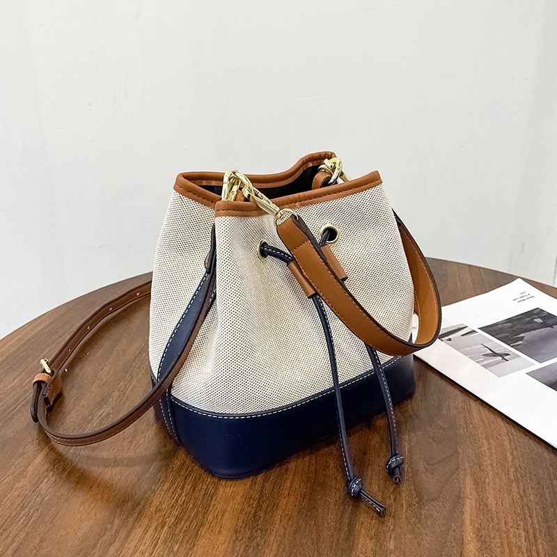 Túi đeo vai canvas kết cấu dạng xô màu sắc tương phản phong cách phương tây 2021 mới thời trang mùa thu nhỏ gọn cho nữ