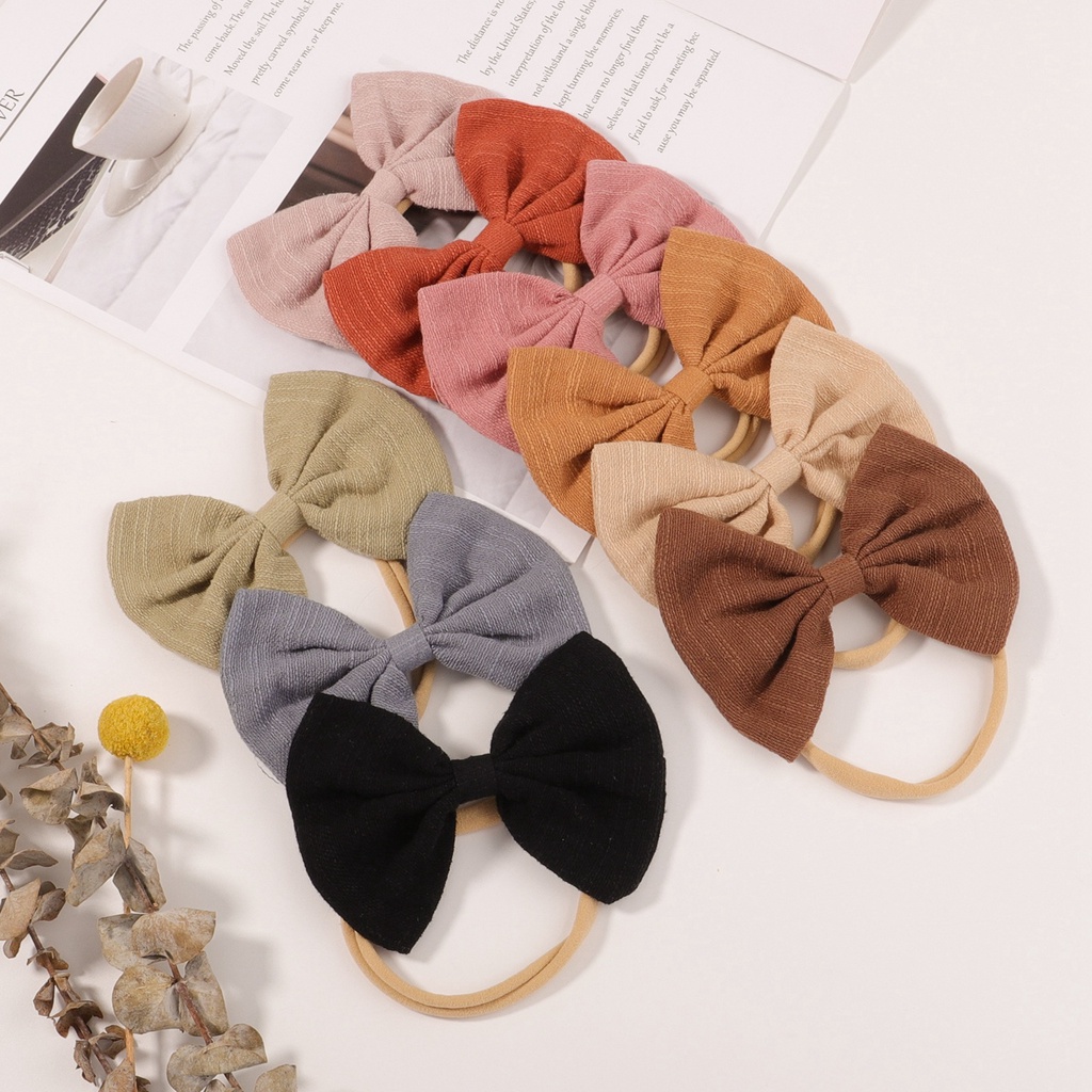 Băng đô Kidsbows nơ làm bằng tay màu trơn dễ thương cho bé gái