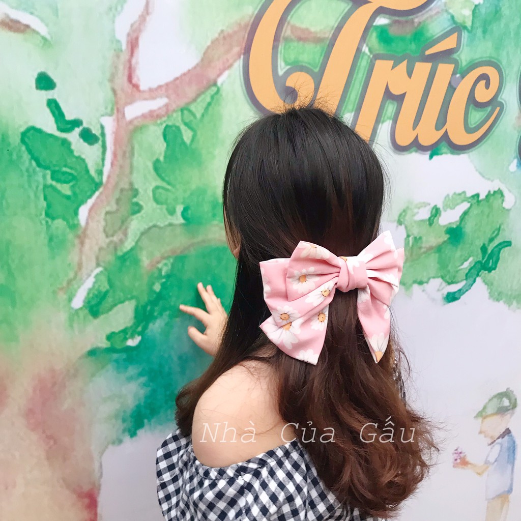 Kẹp tóc nơ hoa cúc dễ thương