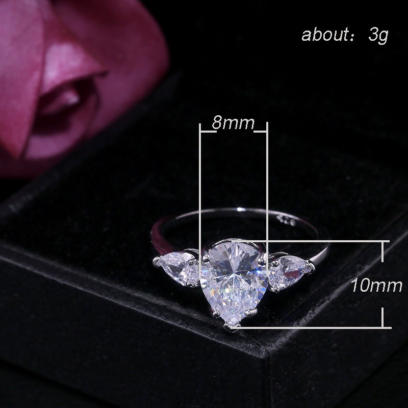 Inlaid water drop pear-shaped zircon ring female European and American creative flash diamond engagement