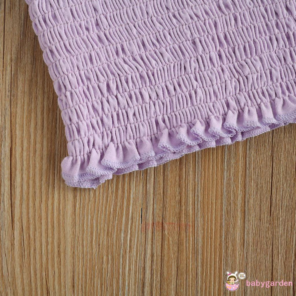 Áo không tay với quần váy ngắn và băng cột tóc thời trang cho bé gái