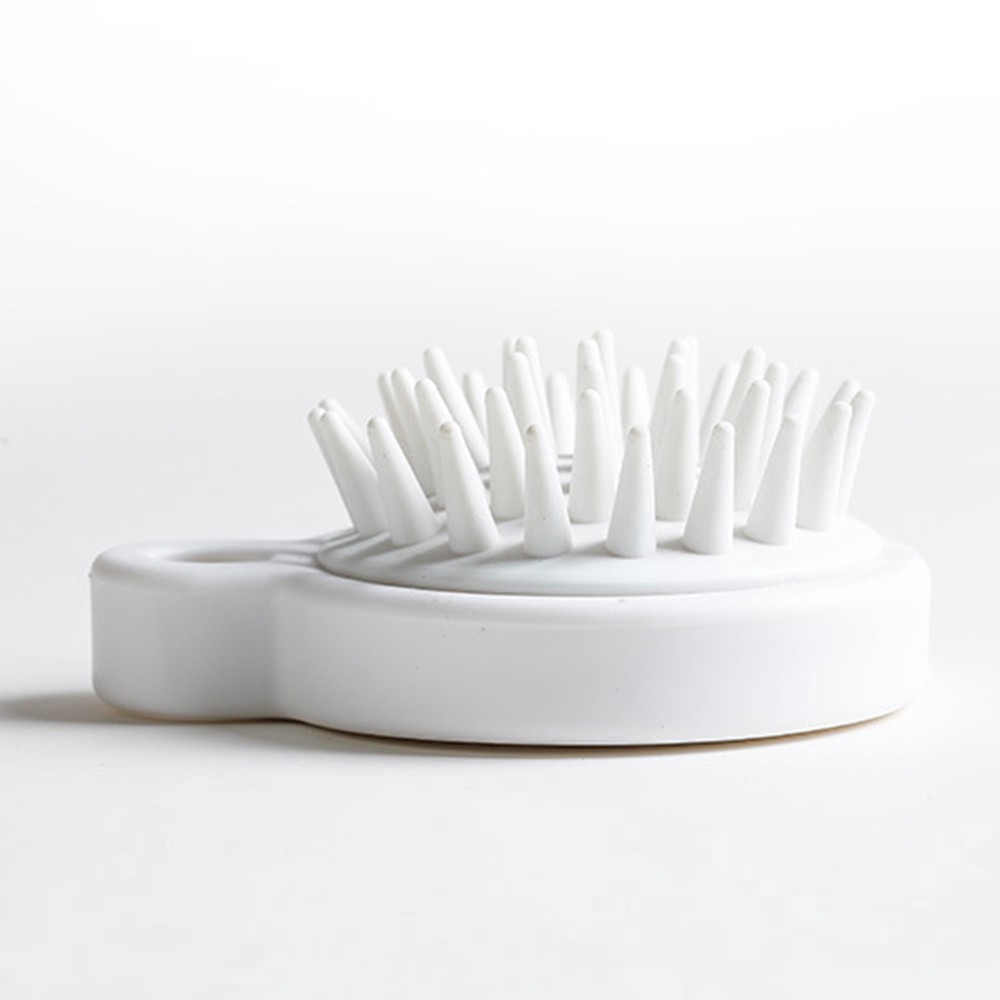 Lược mát xa da đầu mini cầm tay bằng silicon tiện dụng