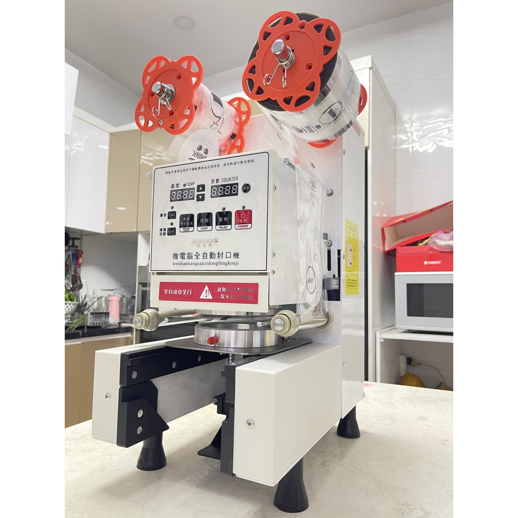 Máy Ép Ly Trà Sữa, Máy Ép Ly Nhựa, Máy Dán Nắp Ly Nhựa – Máy Dán Miệng Ly – Máy Dập Nắp Cốc Trà Sữa Tự động