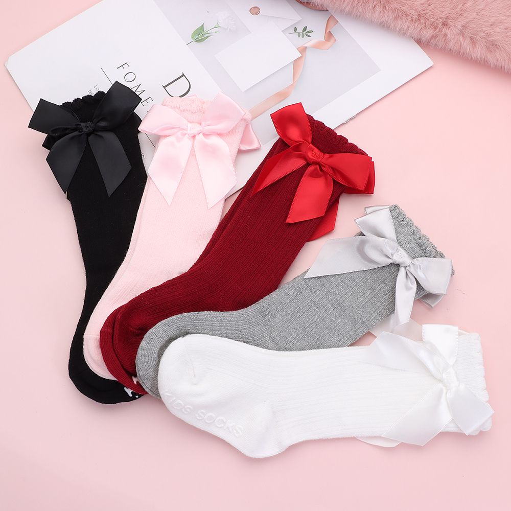 1 đôi vớ cotton dài mềm mại chống trượt phối ren đính nơ xinh xắn cho bé gái