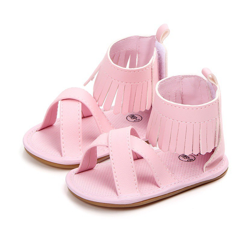 Giày sandal da PU màu trơn quai đan chéo phối tua rua đáng yêu cho bé gái