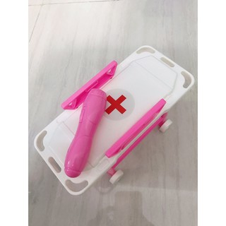 Giường bác sĩ và đèn pin