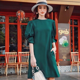 Đầm xanh tay nút bọc