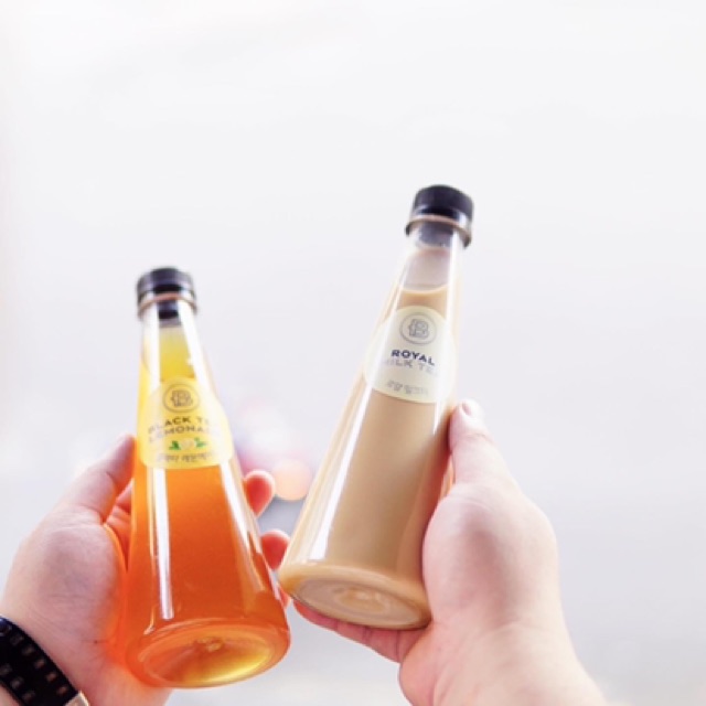 Chai nhựa tam giác trơn nắp đen NHỰA ĐỒNG NAI 330ml dày dặn - đựng nước, trà sữa - kèm nắp