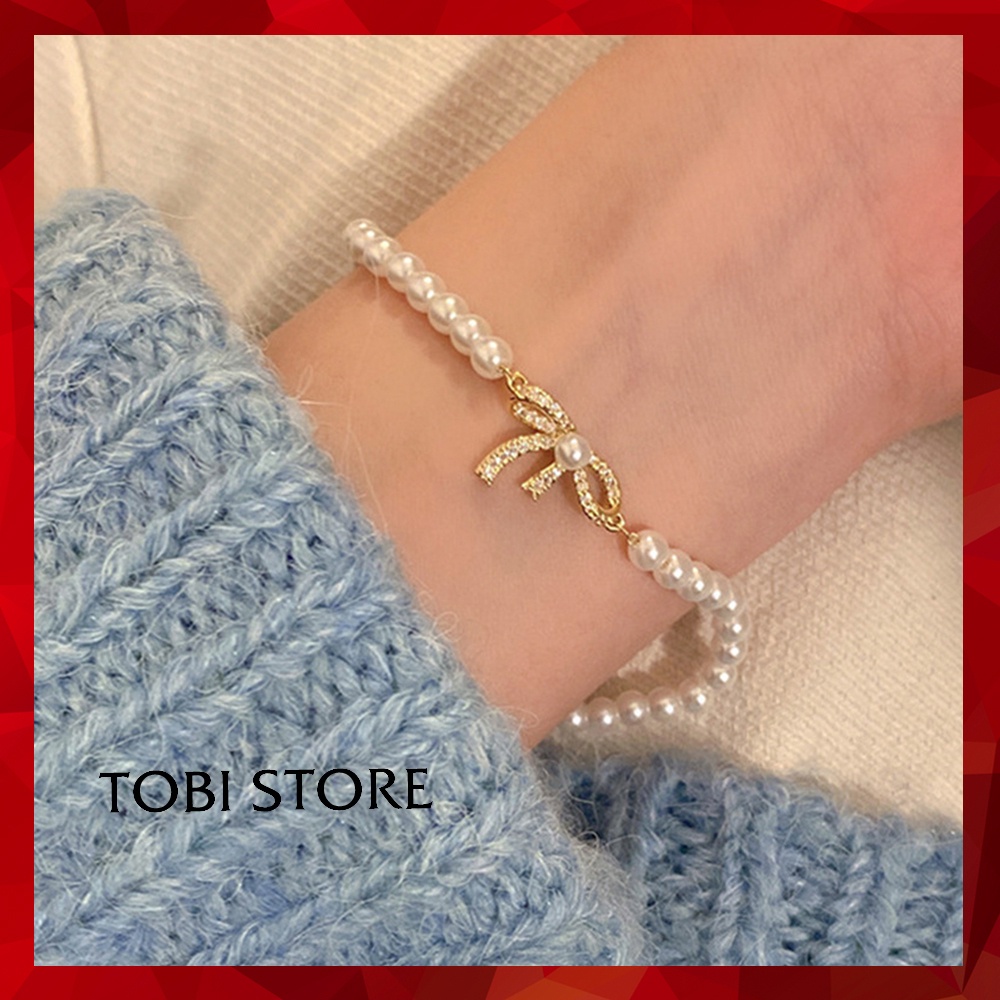 Vòng tay ngọc trai nhân tạo mặt nơ đính đá nhỏ xinh TB481