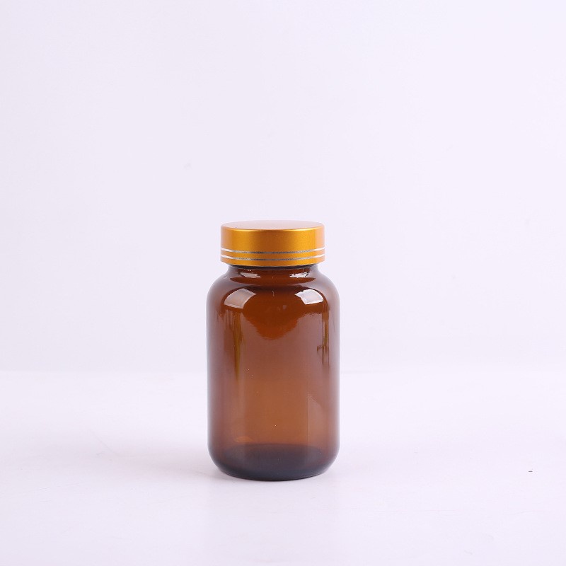 Vỏ chai lọ thủy tinh đựng viên nang 100cc- thùng 192 bộ gồm lo nắp vàng viền màng siu tự dính và  bị