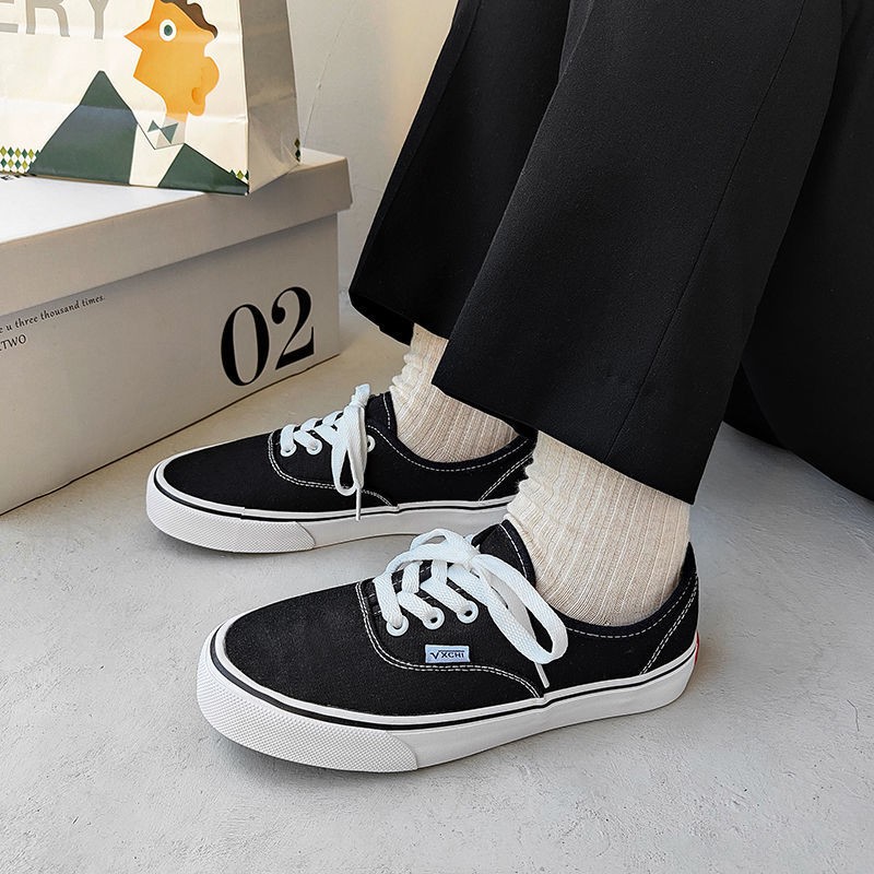 Giày vải canvas đế trắng thời trang đường phố cho nữ 2021