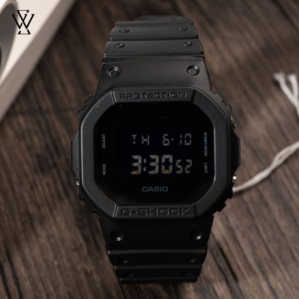 Đồng Hồ Quartz Nam Casio G-Shock WATCHSTORE DW-5600BB-1DR Thiết Kế Mặt Kính Khoáng 43mm, Dây Cao Su Và Vỏ Nhựa Bền Bỉ