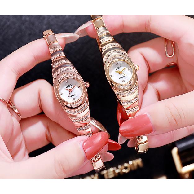 ĐỒNG HỒ NỮ DÂY KIM LOẠI DZG 3 TẦNG NGỌC D381 LẮC TAY SIÊU ĐẸP