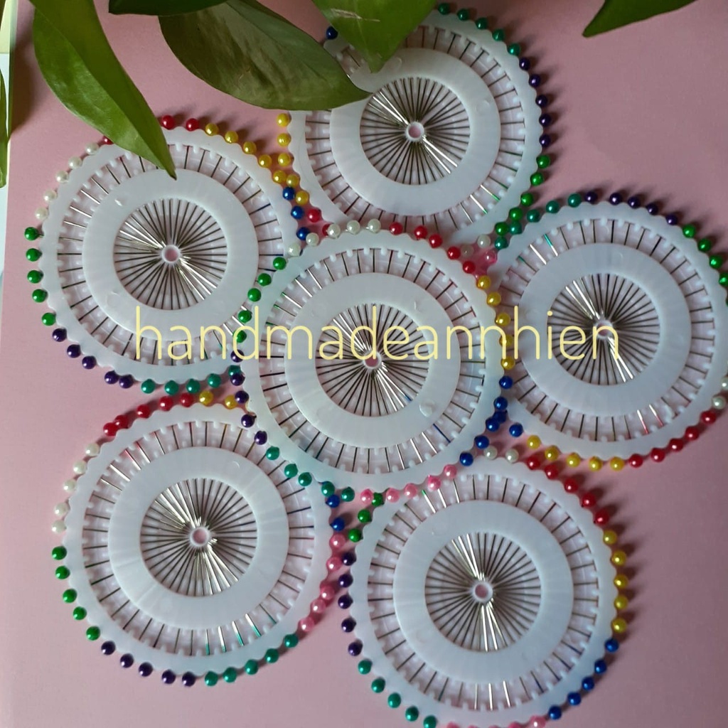 1 vỉ kim cúc cố định vải, cố định rập trên manacanh, đường kính ~ 8cm, có 40 kim