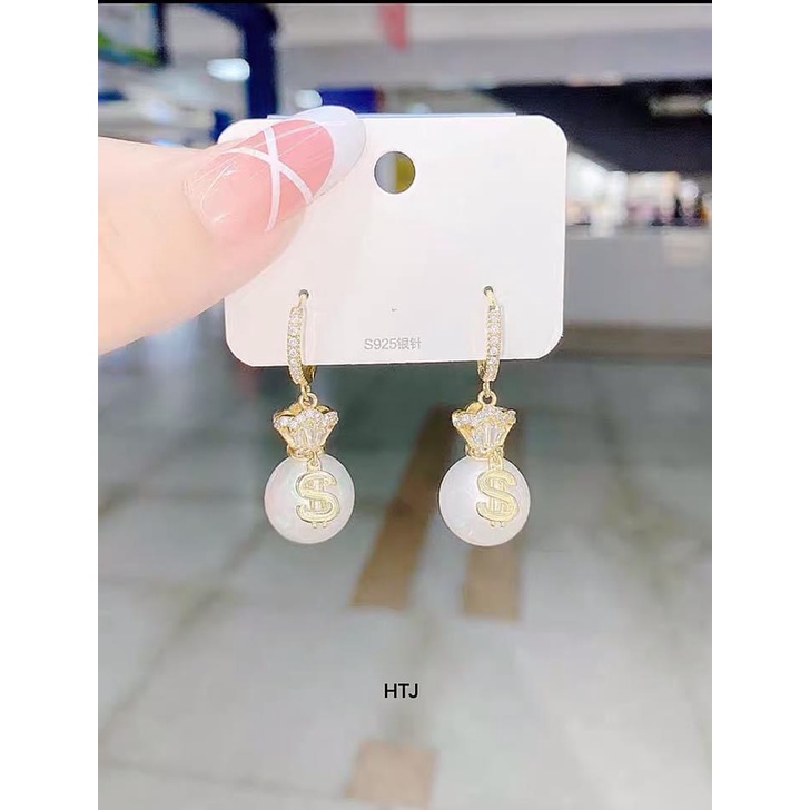 Bông tai túi tiền bạc ta mang lại tài lộc may mắn - Kho sỉ bạc Nhất Linh