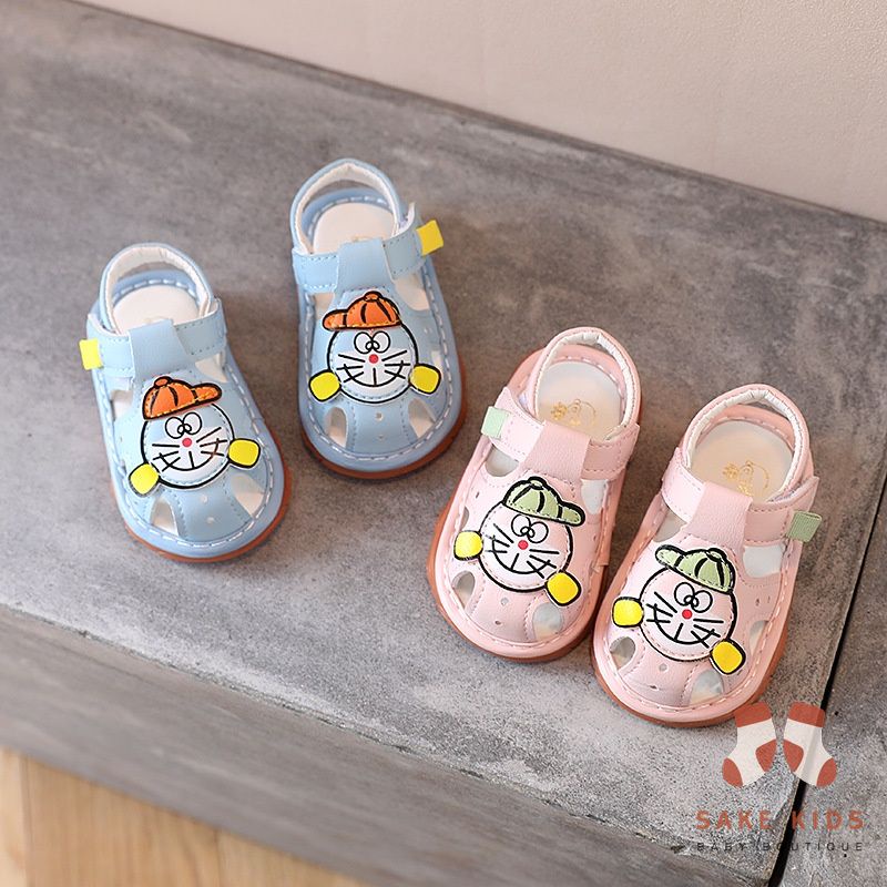 Sandal tập đi bé trai bé gái - Dép rọ có còi hình Đoremon dễ thương chống trơn trượt cho bé từ 0-1 tuổi M301