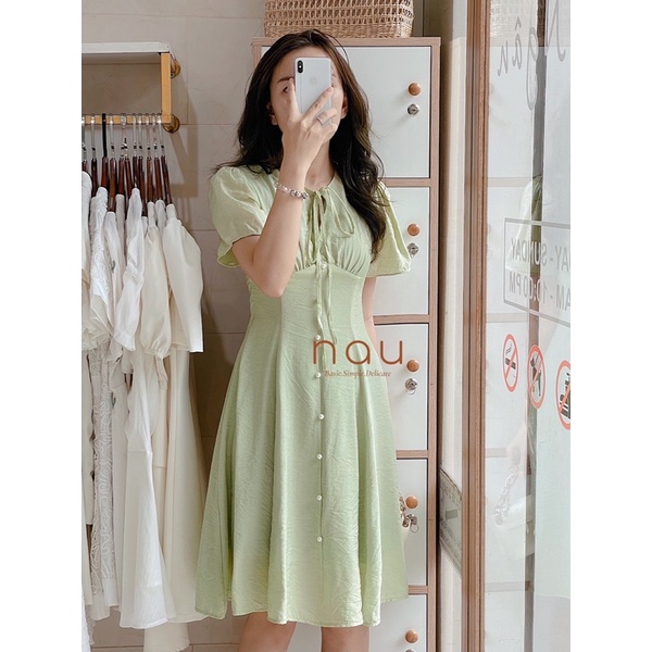 Đầm phối nút ngọc dáng xoè nhẹ cột nơ cổ