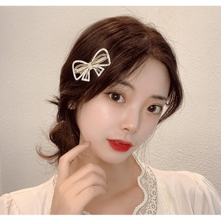 Kẹp tóc mái nơ ngọc trai đính đá