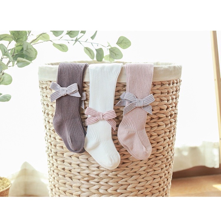 Quần tất len trơn nhiều màu đính nơ to bé gái