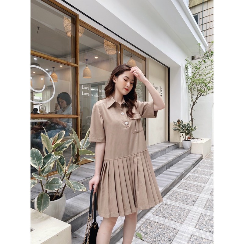 Váy xếp ly cúc đá