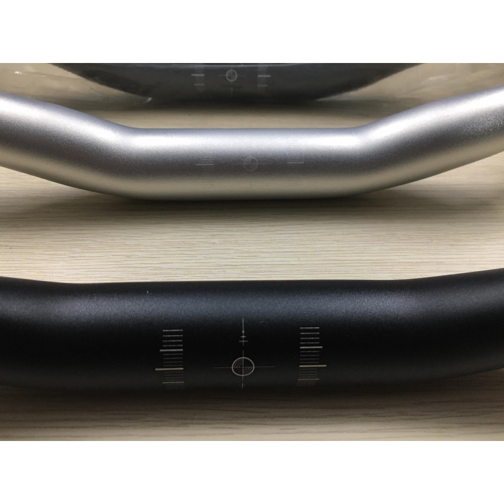 Tay lái / ghi đông VÒNG CUNG ergotec sản xuất Đài Loan , bắt cổ 31,8mm .