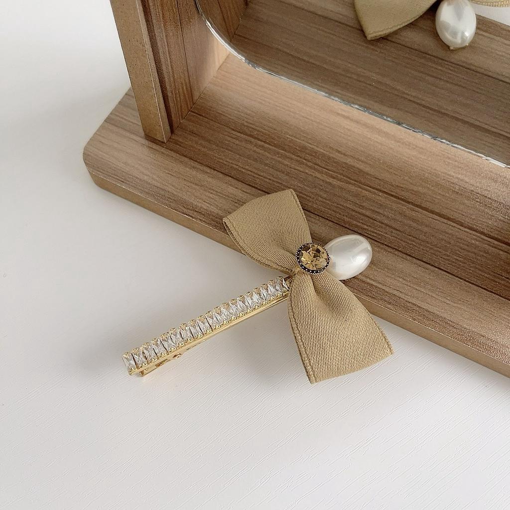 Kẹp tóc nữ hình nơ đính ngọc trai nhân tạo xinh xắn