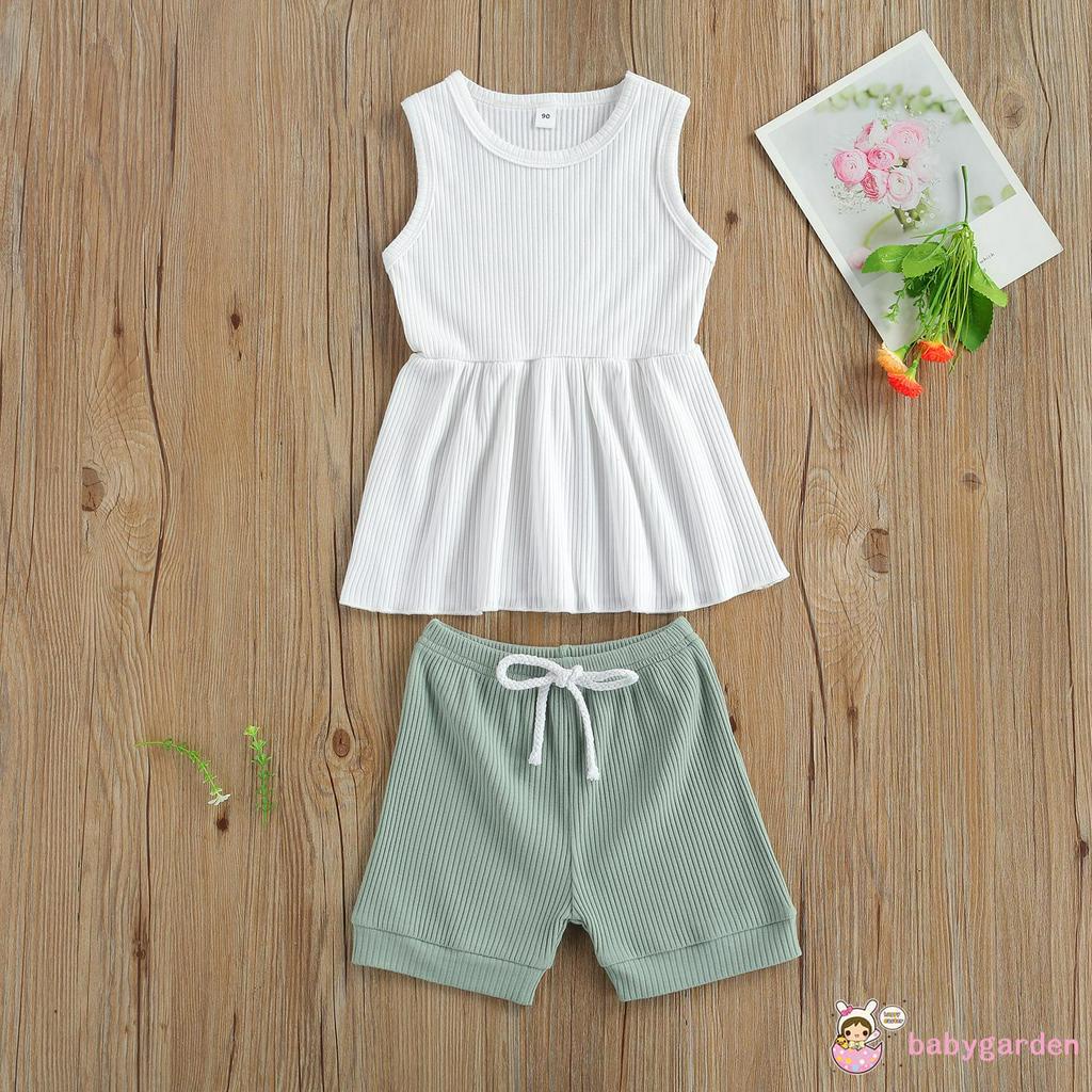 Bộ áo không tay cổ tròn và quần short bằng vải thun gân cho bé gái từ 2-7t