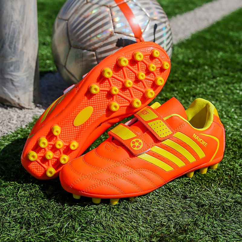 Bảy ngôi sao giày bóng đá trẻ em Velcro dài móng tay gãy đinh cắt thấp nam và nữ học sinh tiểu học mang giày đào tạo chố