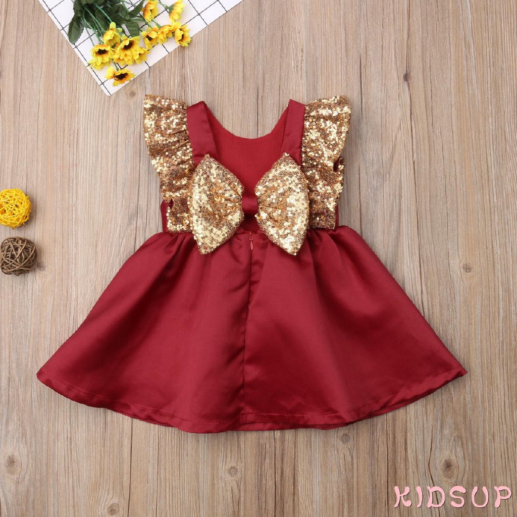 Đầm xòe không tay trang trí nơ đính kim tuyến xinh xắn cho bé gái