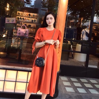 Đầm cam tay nơ