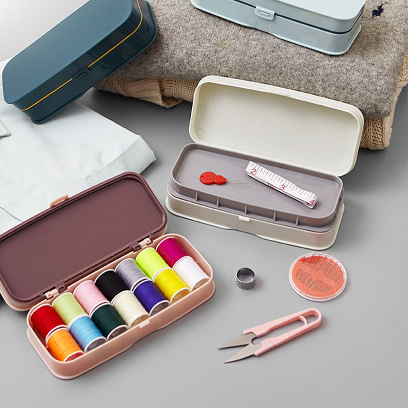 A box of needle and thread combination hand-held double-layer sewing with lock with tape measure and linen kit.