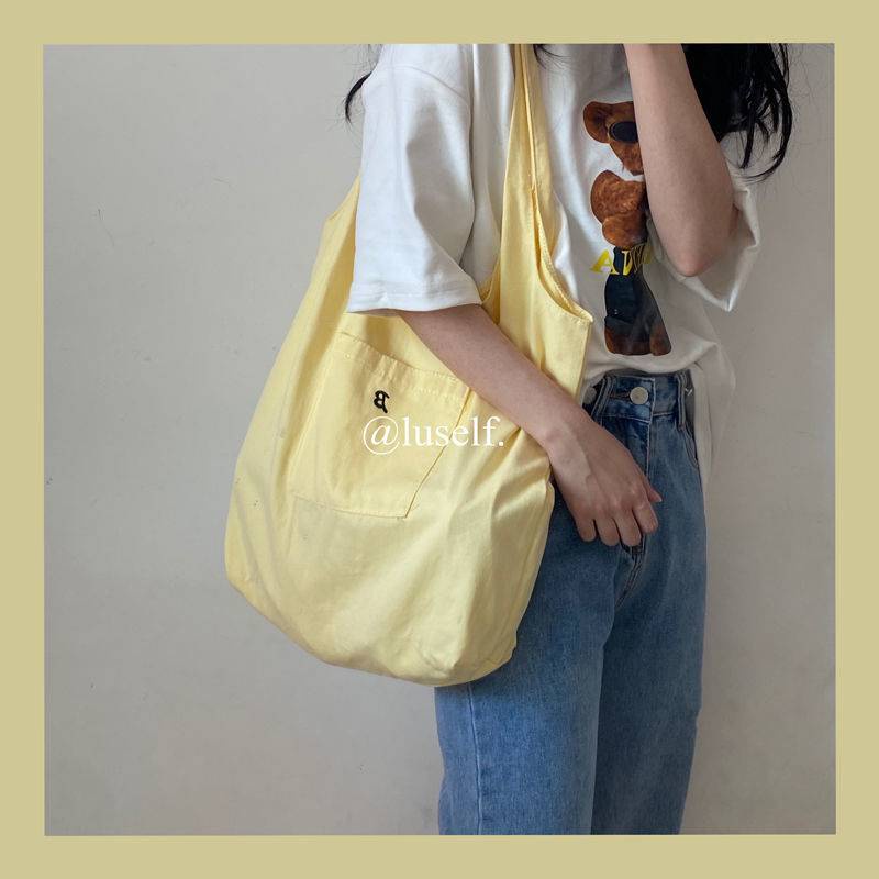 Túi đeo vai vải canvas màu vàng nhạt phong cách hè dành cho nữ