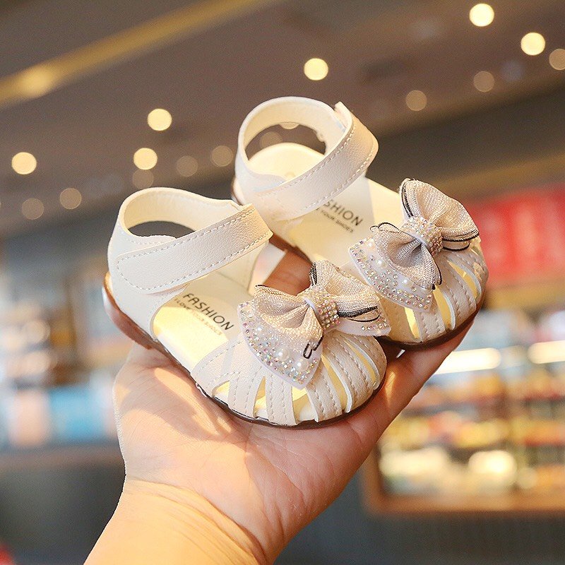 Sandal tập đi cho bé gái - dép quai hậu rọ cho bé từ 6th-4 tuổi có nơ đính đá chống trơn chống vấp siêu cute (A9)