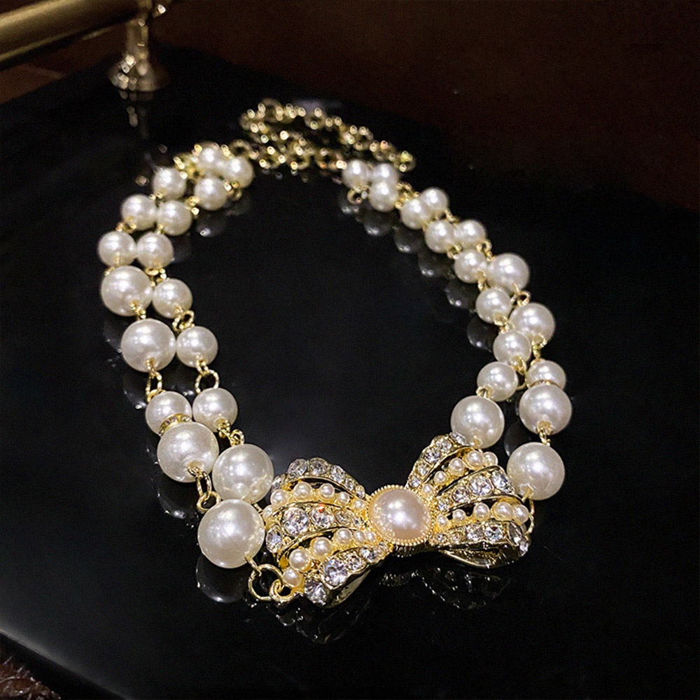 Vòng cổ choker hai lớp đính ngọc trai và nơ thời trang